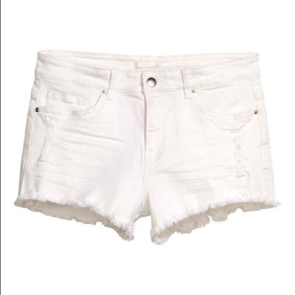 ripped white denim shorts: brand is “H&M”